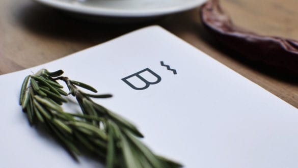 A close-up of a white piece of paper with the letter b