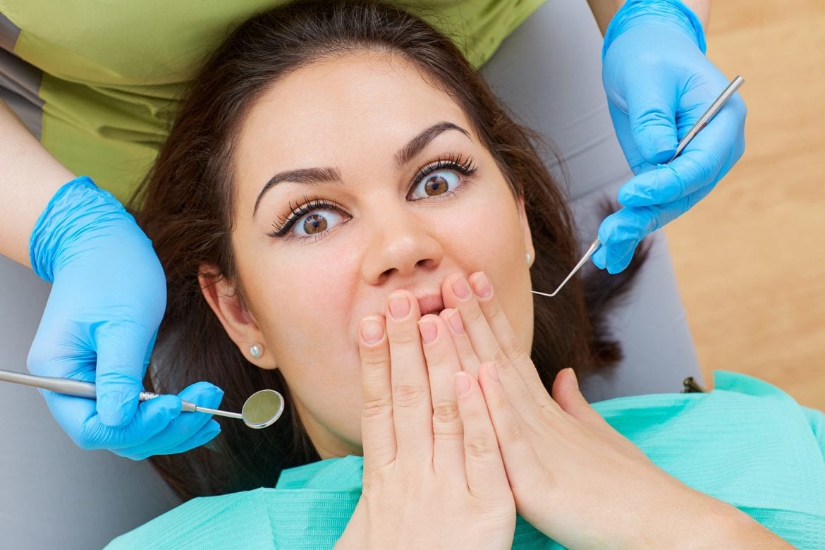 Frightened Young Woman At A Dentist Appointment
