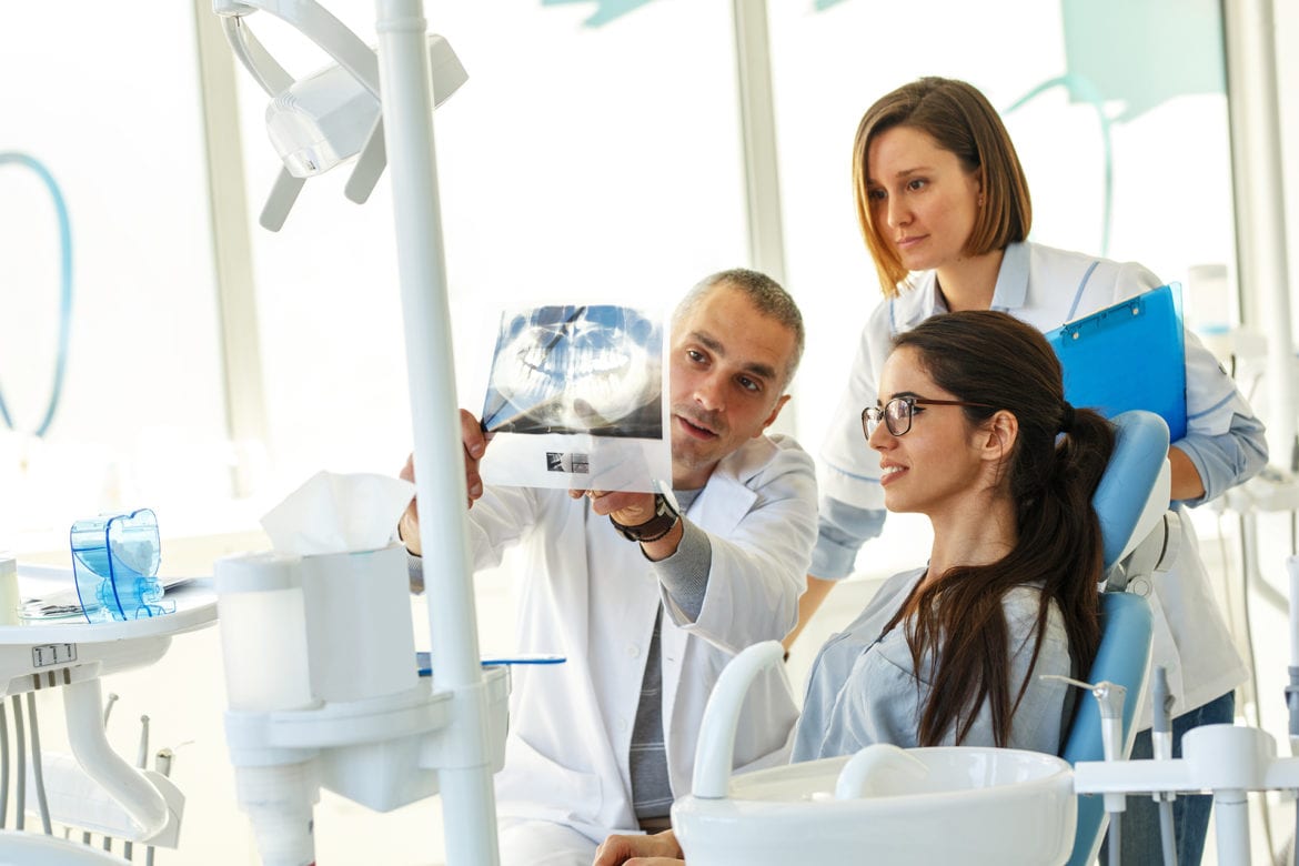 dentists reviewing patient x ray