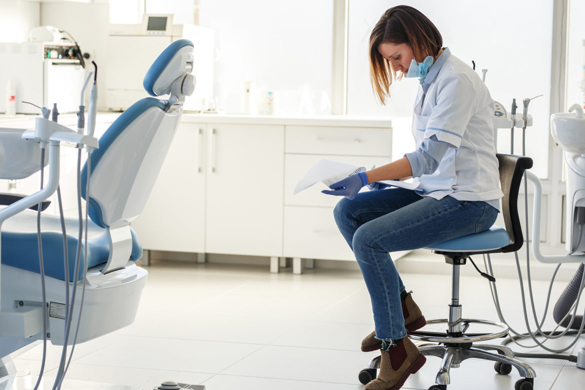 dentist reviewing paperwork