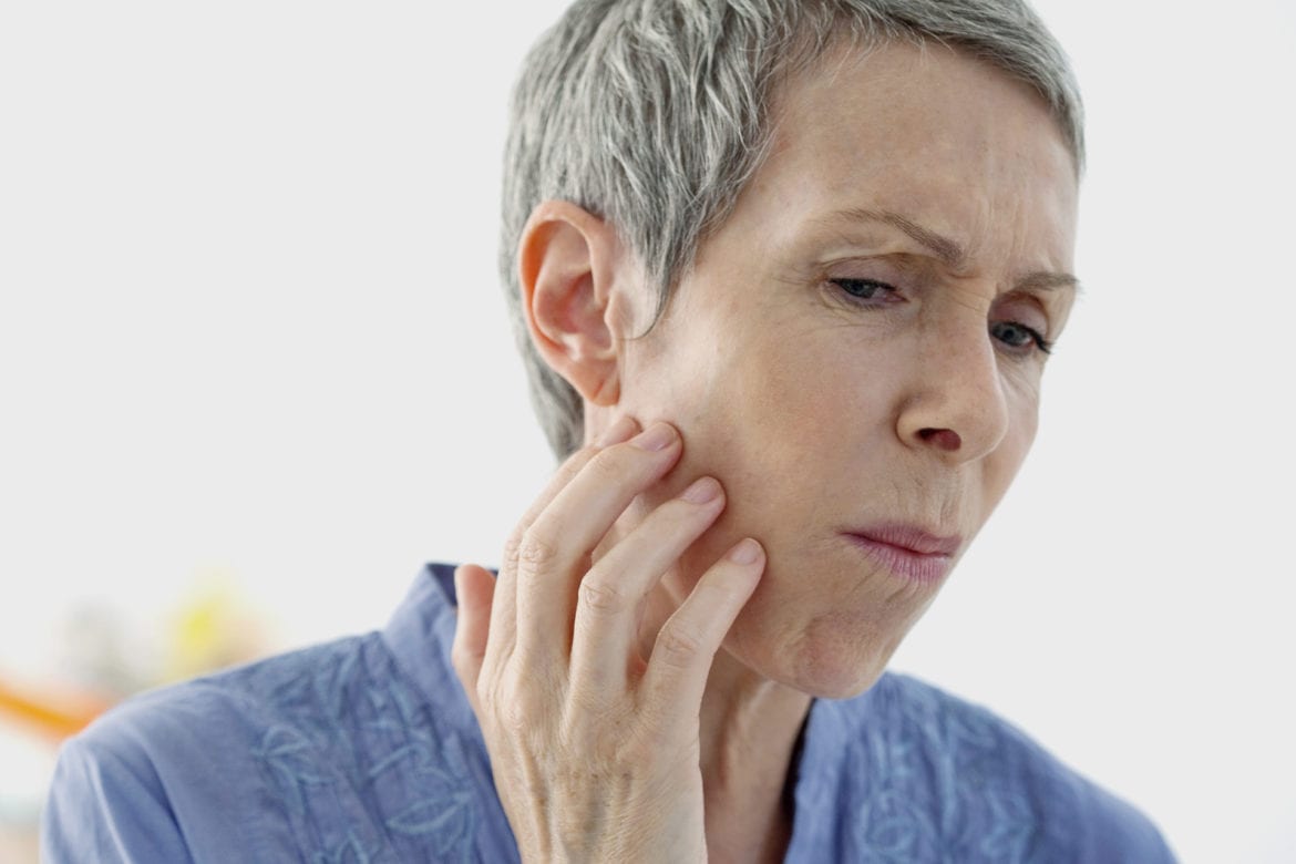 blog-eds-jawpain2 An elderly woman is experiencing tooth pain