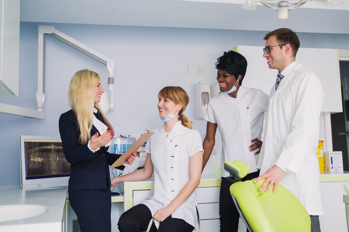 blog-eds-officefuture Office representative speaking with the dentist and staff