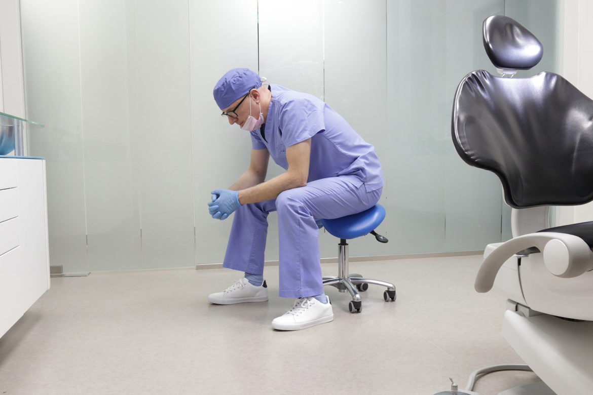 dentist dealing with burnout from his job
