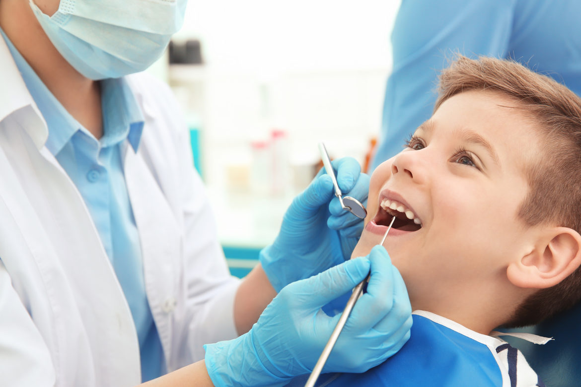 blog-eds-oralhealthequity A little boy enjoying his time at the dentist