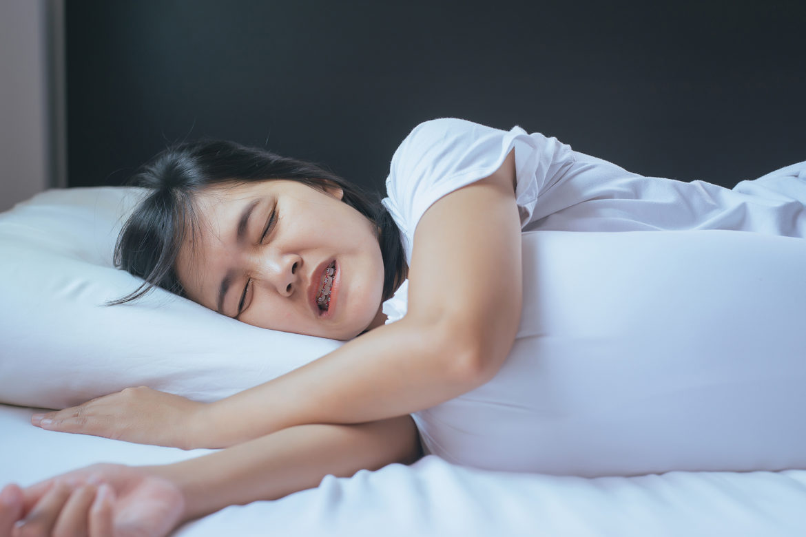 blog-eds-sleepgrinding woman grinding her teeth while sleeping