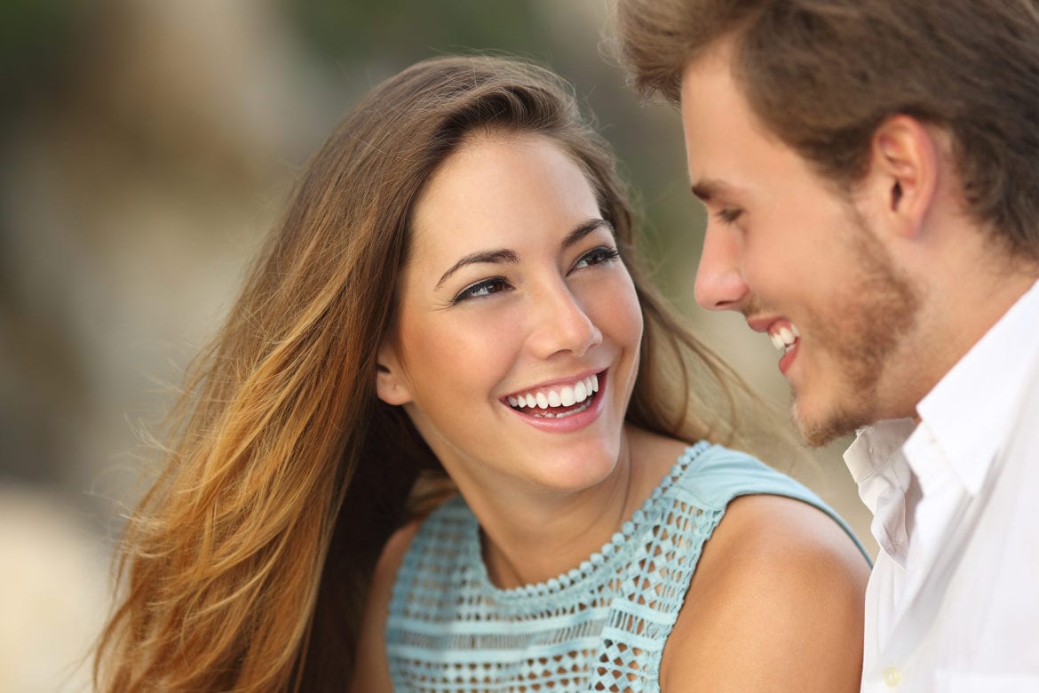 man and woman smiling at each other