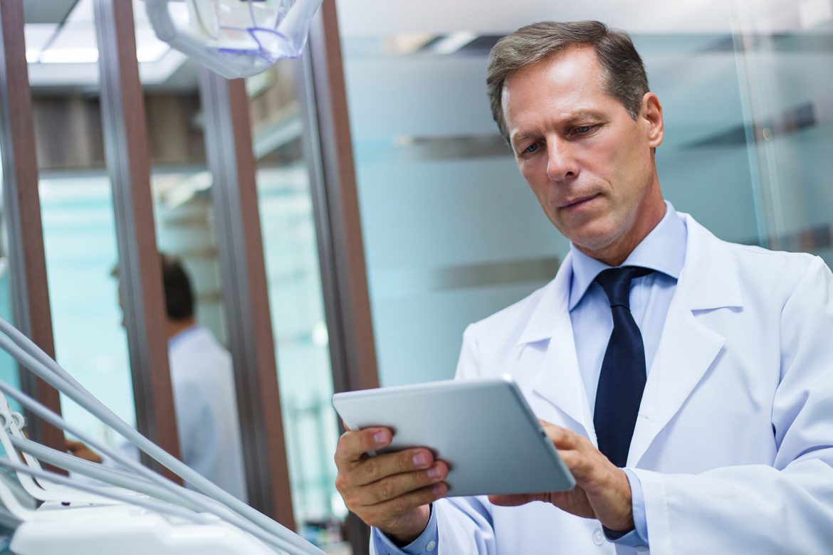dentist holding tablet
