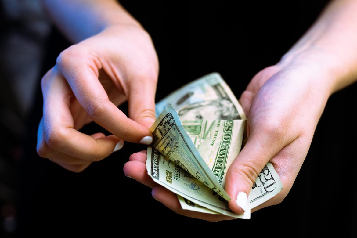hands holding money