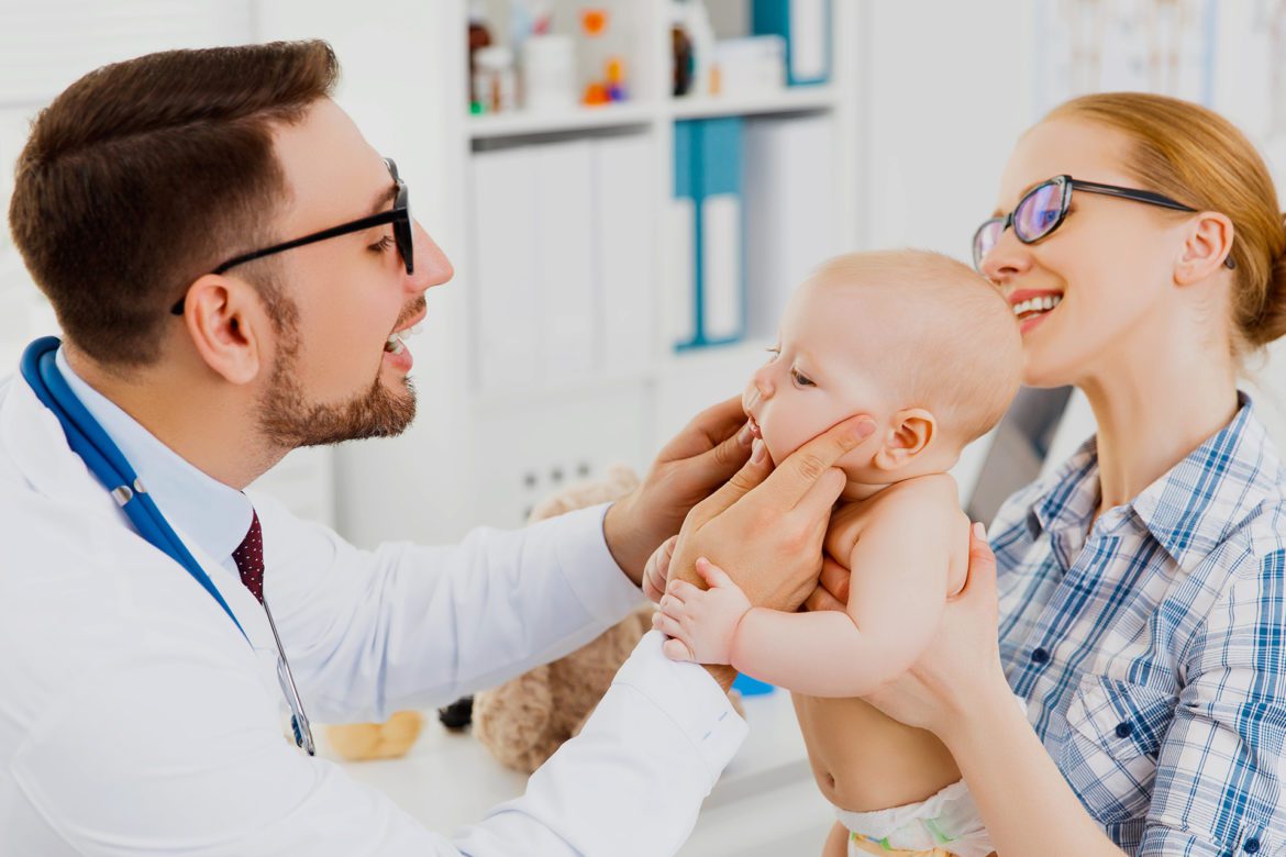 Baby is having his first dentist visit.
