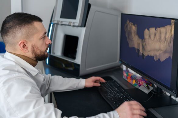 Dentist examining a set of tooth x-rays on a computer