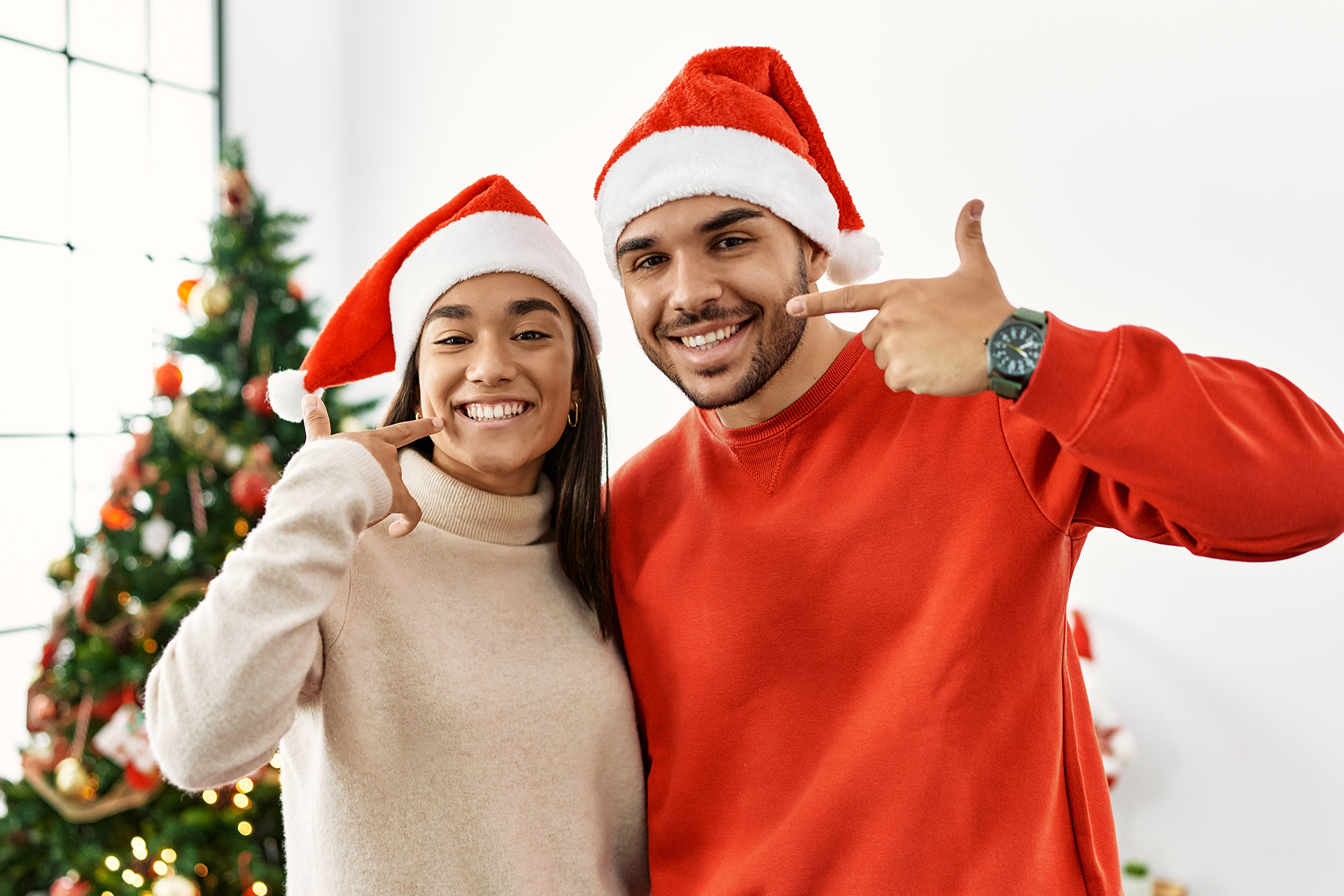EDS- Man and woman smiling at Christmas time